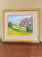 Framed oil painting on tabletop