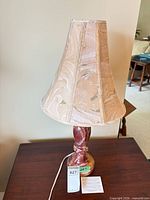 Full view of lamp showing base and shade