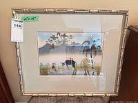 full view of framed print showing image, mat, and silver bamboo frame