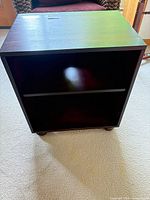 Front view of dark brown two-shelf bookcase