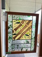 Full view of stained glass panel hanging in doorway