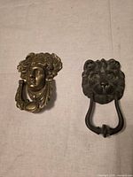 Front view of both door knockers showing designs and finishes