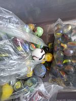 Bags of multicolor marbles with swirl and metallic finishes