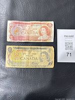 Obverse of both banknotes showing denominations, portrait and serials