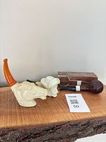 All three pipes and box on shelf