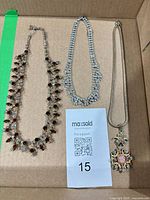 Overview of three necklaces in box