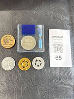 All tokens and acrylic hourglass block on leather surface