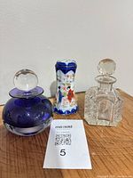 Front view of all three pieces on wooden surface