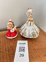 Front view of both figurines showing size difference and details