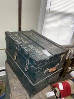 Overall view of military trunk showing side hardware and leather handle