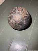 Overall view of the cannon ball showing size and surface condition