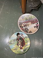 Two plates side-by-side on floor
