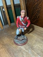Front view of resin soldier figurine on round base