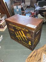 Front of wooden military ammunition crate with stencilled cartridge data