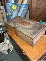 Full view of wooden military box exterior on tabletop