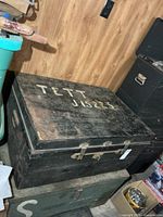 Top view of metal trunk showing stenciled TETT J15223