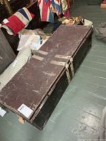 Top view of metal trunk showing overall size, color and wear