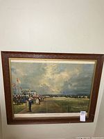 Full view of framed military parade print on wall