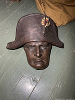 Front view of plaster Napoleon head with bicorne hat