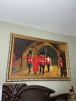 Full view of framed oil painting above headboard