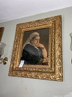 Full view of framed portrait on wall