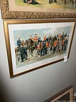 Framed chromolithograph print on wall showing full composition