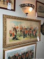 Full view of framed lithograph on wall showing size and frame detail