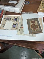 overview of folder contents, multiple decal sheets and fabric patch visible