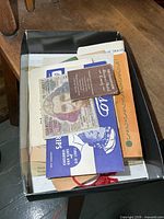 Open box showing entire assortment of vintage paper ephemera