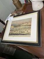 Framed print on furniture surface
