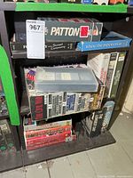 Shelving with Patton, Sunset Ceremony, When The Pipers Play and other war VHS titles