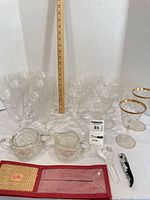 Group shot showing all stemware, cut glass pieces, stopper, corkscrew and pouch