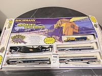 Full box front showing train set contents and branding