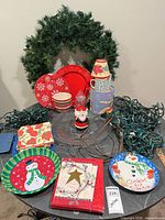 Overall lot view showing wreath, tableware and lights