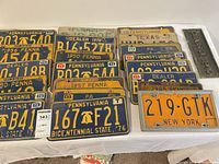 Overall view of assorted license plates on table