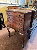 Full view front/right of 5-drawer mahogany chest on cabriole legs