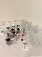 Full lot overview showing goblets, tray, pewter items, perfume bottle