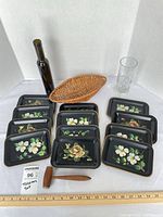 Group shot showing all 12 trays plus basket, mallet, bottle and glass