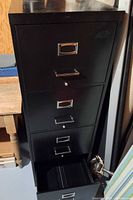front view showing all four drawers, one open