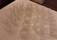 Full assortment of crystal glasses laid out on table