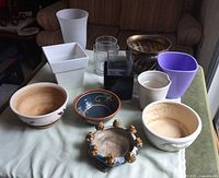 All 12 planters and vases grouped on table