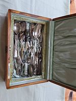 Utensils stored inside wooden chest