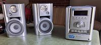 Front view of full Sony stereo system showing main unit and two speakers
