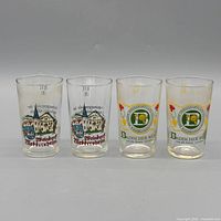 Front view of four printed tumblers showing both design variants and condition
