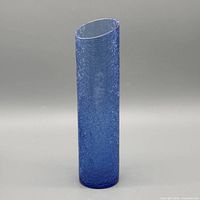 Full front view of blue crackle glass cylinder vase