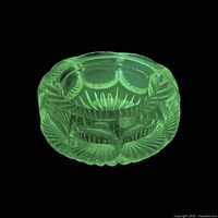 Salt cellar glowing green under UV light