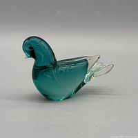right side profile of teal glass bird