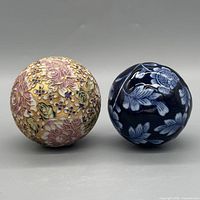 Gold floral sphere and blue floral sphere front view