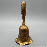 Full view of brass hand bell front