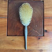 Full view of Birks sterling silver vanity hairbrush, bristle side up